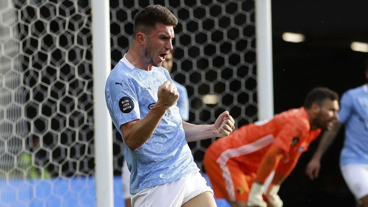 Manchester City's Aymeric Laporte celebrates after scoring his side's fourth goal during the English Premier League soccer match between Watford and Manchester City at the Vicarage Road Stad ...