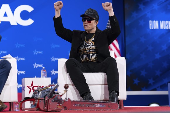 Elon Musk gestures during the Conservative Political Action Conference, CPAC, at the Gaylord National Resort &amp; Convention Center, Thursday, Feb. 20, 2025, in Oxon Hill, Md. (AP Photo/Jose Luis Mag ...