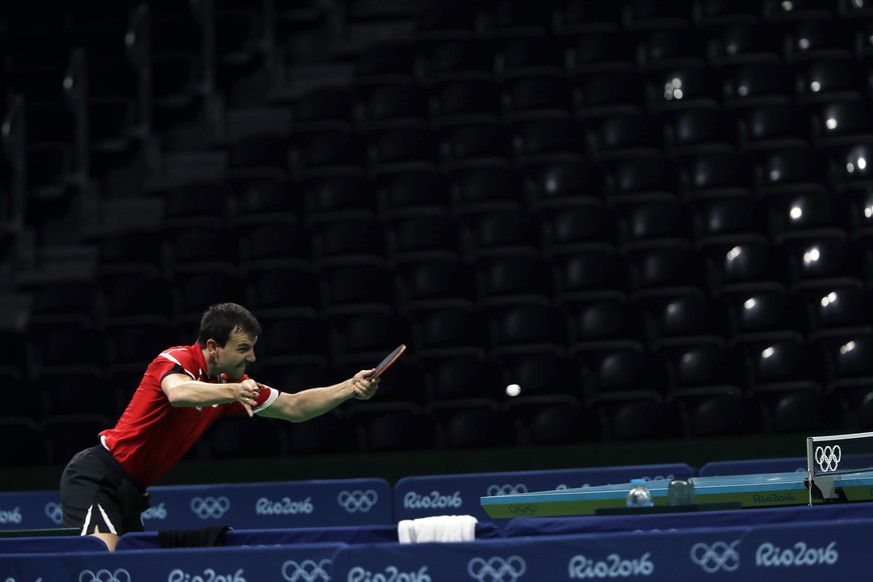 Germany&#039;s Timo Boll returns the ball during a men&#039;s table tennis training session ahead the 2016 Summer Olympics in Rio de Janeiro, Brazil, Tuesday, Aug. 2, 2016. (AP Photo/Petros Giannakour ...