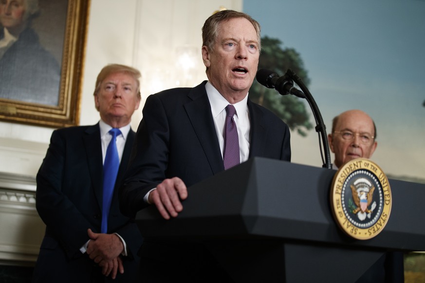 President Donald Trump, left, and Secretary of Commerce Wilbur Ross, right, listen to United States Trade Representative Robert Lighthizer speak during an event to announce tariffs and investment rest ...