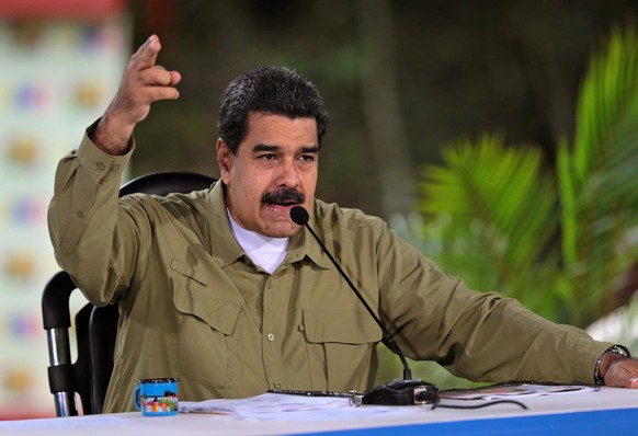 epa06129356 A handout photo made available by Miraflores Palace Press Office on 06 August 2017 shows Venezuelan President Nicolas Maduro as he speaks during a government act at Vinicio Adames Park, in ...