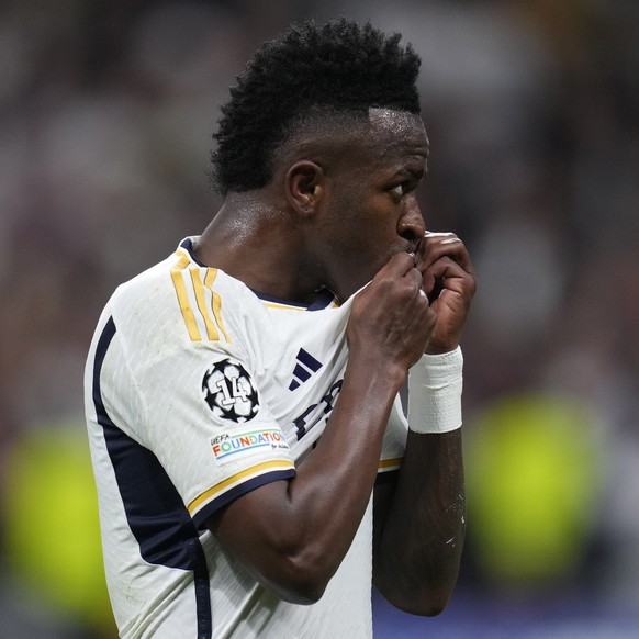 Real Madrid&#039;s Vinicius Junior celebrates after scoring his side&#039;s opening goal during the Champions League round of 16 second leg soccer match between Real Madrid and RB Leipzig at the Santi ...