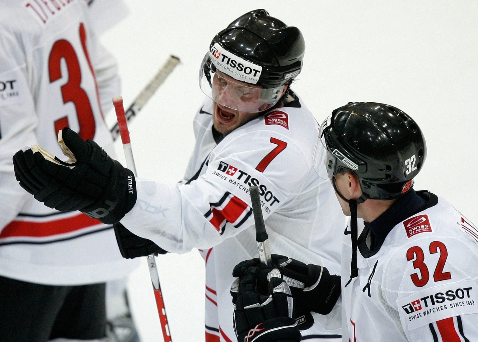 Swiss players Mark Streit (7) and Ivo Ruethemann (32) discuss after losing the Group B Preliminary Round Robin game between Russia and Switzerland at the IIHF 2009 World Championship at the Postfinanc ...