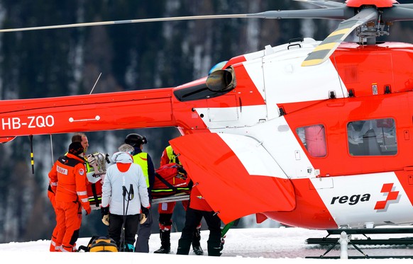 Michelle Gisin of Switzerland is being carried on a stretcher after a fall during an alpine ski, women's World Cup downhill training, in St. Moritz, Switzerland, Thursday, Dec. 11, 2025. (Keyston ...