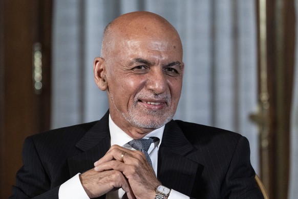 FILE - Afghan President Ashraf Ghani is seated after his meeting with U.S. President Joe Biden in Washington, June 25, 2021. In an interview aired by the BBC on Thursday, Dec. 30, 2021, Afghanistan&#0 ...