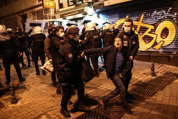 epa08982135 Turkish riot police detains a protestor during a protest against Turkish President Erdogan&#039;s appointed rector at the Bogazici University in Istanbul, Turkey, 02 February 2021. Turkish ...