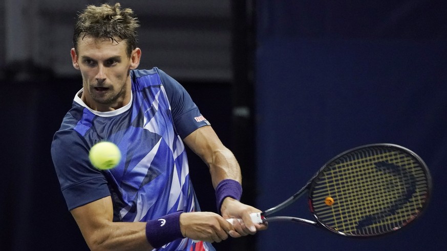 epa07798395 Henri Laaksonen of Switzerland hits a return to Marco Cecchinato of Italy during their match on the second day of the US Open Tennis Championships the USTA National Tennis Center in Flushi ...