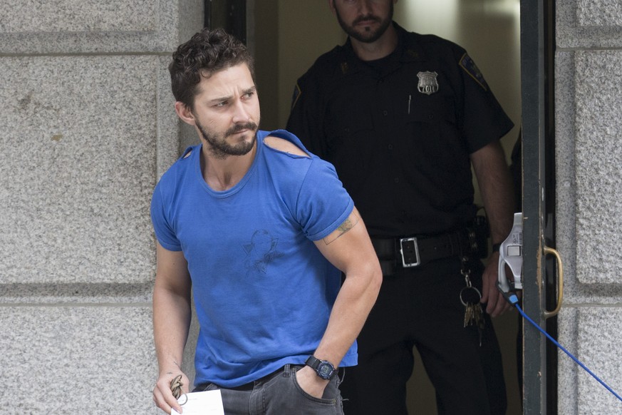 Actor Shia LaBeouf leaves Midtown Community Court after being arrested the previous day for yelling obscenities at the Broadway show &quot;Cabaret,&quot; Friday, June 27, 2014, in New York. The 28-yea ...