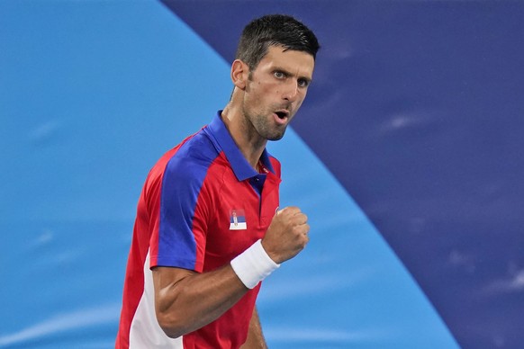 Novak Djokovic, of Serbia, reacts while playing Kei Nishikori, of Japan, during the quarterfinals of the tennis competition at the 2020 Summer Olympics, Thursday, July 29, 2021, in Tokyo, Japan. (AP P ...