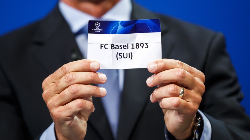 Michael Heselschwerdt, UEFA head of club competitions, draws the ticket of the Swiss soccer team &quot;FC Basel 1893&quot; during the second qualifying round, league path, draw of the UEFA Champions L ...