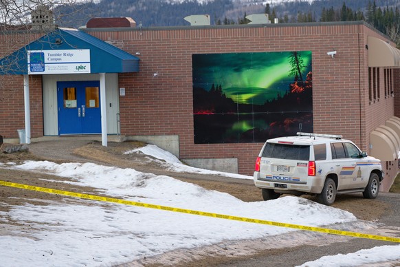 Police began putting tape out near theTumbler Ridge Secondary School and surrounding buildings in Tumbler Ridge, B.C. on Wednesday, Feb. 11, 2026. (Jesse Boily/The Canadian Press via AP)
Canada Shooti ...