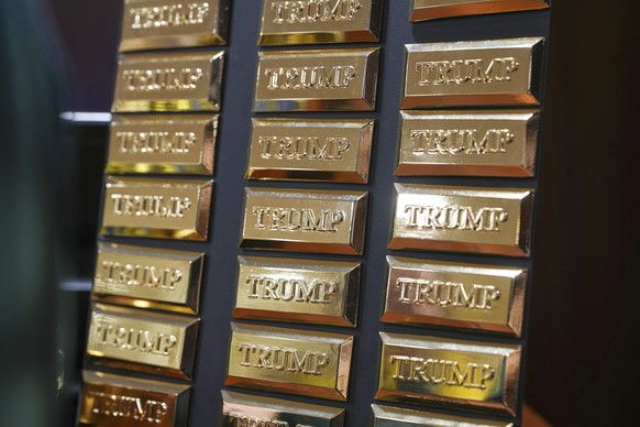 Trump branded gold coloured bullion fridge magnets are seen for sale at the recently opened Trump merchandise store at Trump Turnberry golf club in Turnberry, Scotland, Monday, July 28, 2025. (Christo ...