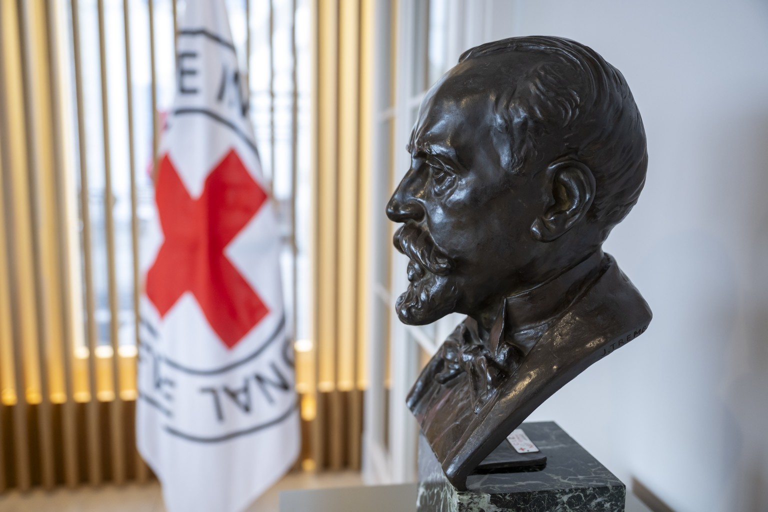 The statue of Henry Dunant, the founder of the Red Cross the International Committee of the Red Cross (ICRC) headquarters is pictured, in Geneva, Switzerland, Friday, November 21, 2025. ICRC will have ...