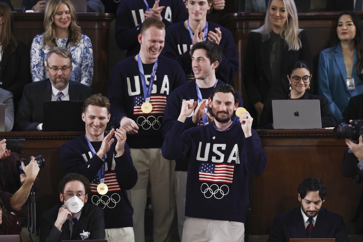 epa12775059 Starting goalie for Team USA Connor Hellebuyck, with his teammates, look on as US President Donald Trump delivers his State of the Union address before a joint session of Congress in the H ...