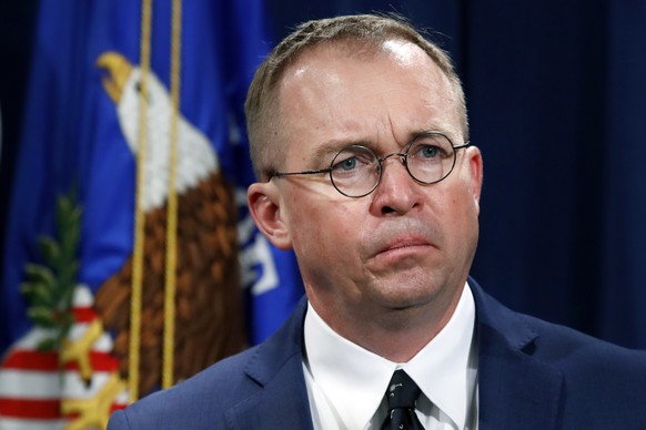 FILE- In this July 11, 2018, file photo Mick Mulvaney, acting director of the Consumer Financial Protection Bureau (CFPB), and Director of the Office of Management, listens during a news conference at ...
