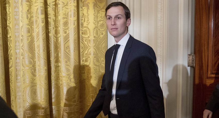 FILE - In this Sunday, Jan. 22, 2017, file photo, President Donald Trump&#039;s White House Senior Advisors Jared Kushner, left, and Steve Bannon, right, arrive at a White House senior staff swearing  ...