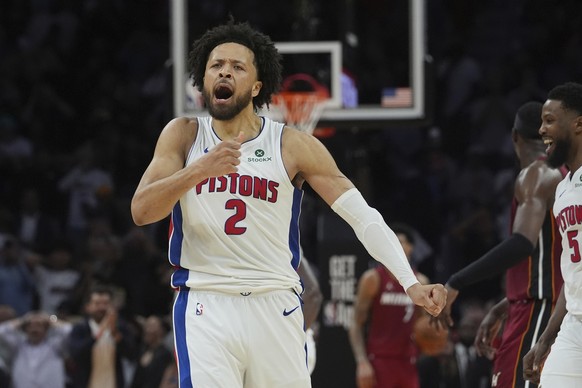 Detroit Pistons guard Cade Cunningham (2) celebrates after scoring the winning basket during the second half of an NBA basketball game against the Miami Heat, Wednesday, March 19, 2025, in Miami. (AP  ...