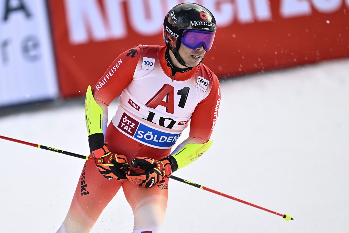 Gino Caviezel of Switzerland reacts in the finish area during the second run of the Men's Giant Slalom race of the FIS Alpine Skiing World Cup season opener on the Rettenbach glacier, in Soelden, ...