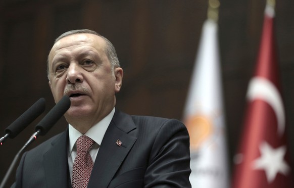 Turkey&#039;s President Recep Tayyip Erdogan delivers a speech to members of parliament of his ruling Justice and Development Party at the parliament in Ankara, Turkey, Tuesday, Nov. 27, 2018. Erdogan ...