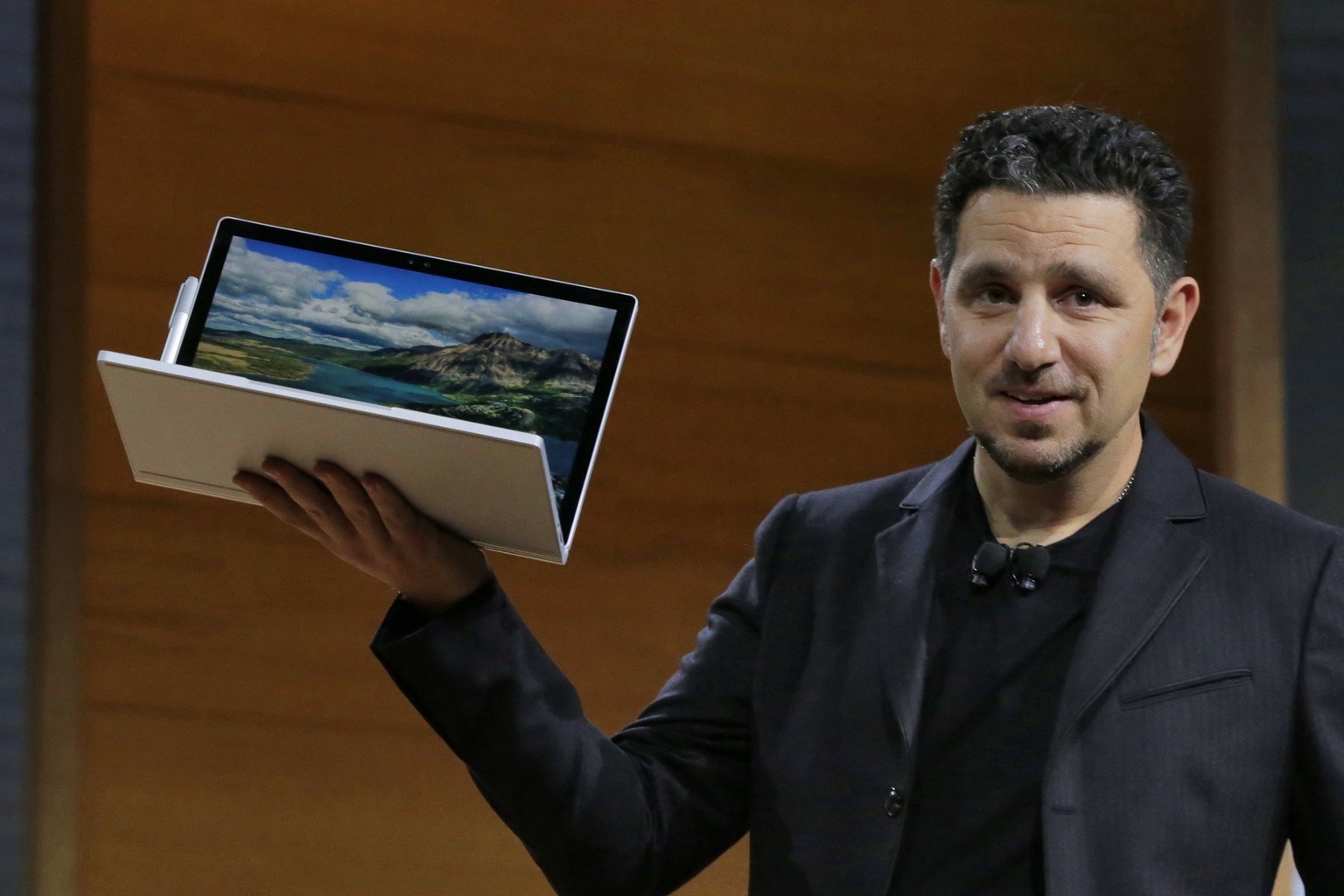 Panos Panay, corporate vice president for Surface Computing at Microsoft Corp., displays the Surface Book during the company&#039;s media event in New York, Wednesday, Oct. 26, 2016. (AP Photo/Richard ...