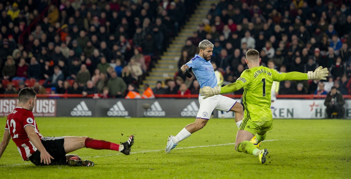 epa08148711 Manchester City's Sergio Aguero scores the first goal during the English Premier League soccer match between Sheffield United and Manchester City at Bramall Lane, Sheffield, Britain,  ...