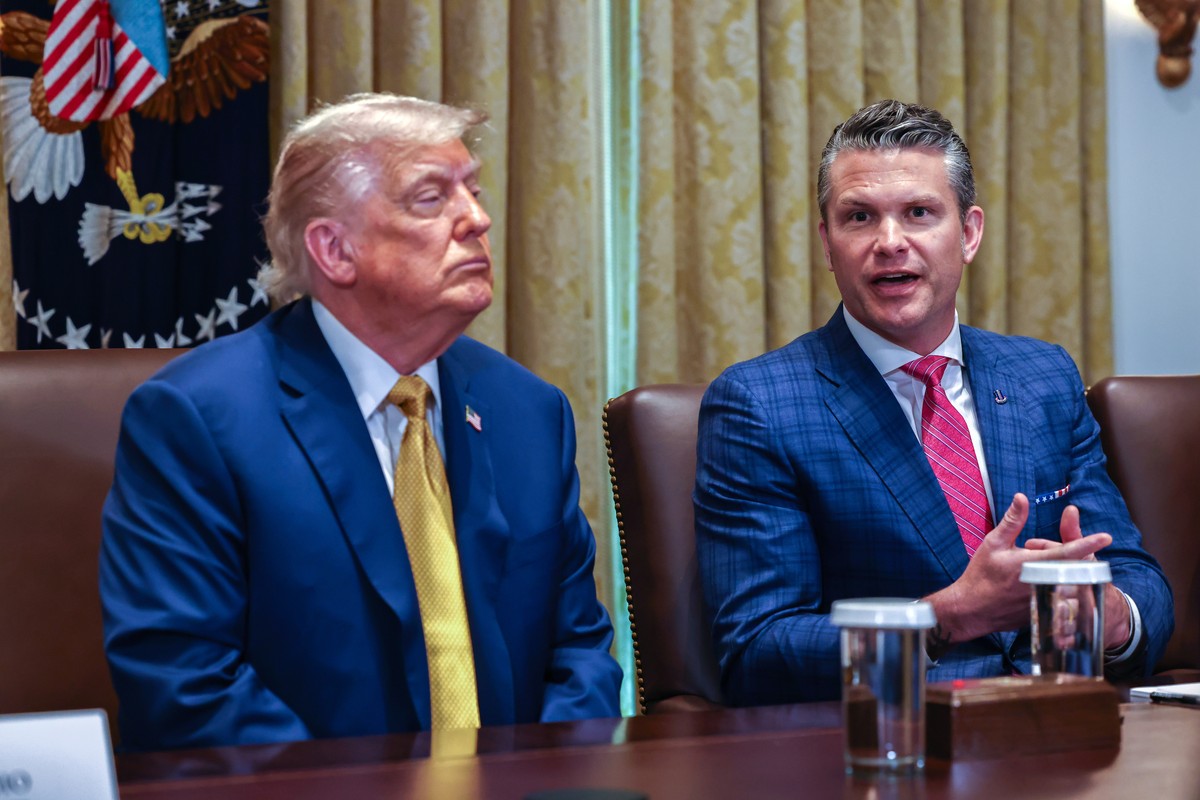 epa12225101 US President Donald J Trump (L) listens as US Secretary of Defense Pete Hegseth speaks during a cabinet meeting in the Cabinet Room of the White House in Washington, DC, USA, 08 July 2025. ...
