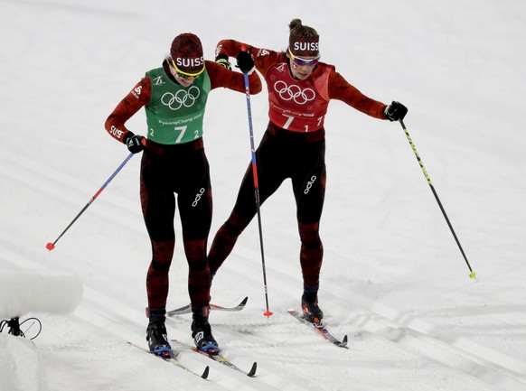 Der Graaff Laurien Van, of Switzerland, right. hands off to Nadine Faehndrich during the women&#039;s 4 x 5km relay cross-country skiing competition at the 2018 Winter Olympics in Pyeongchang, South K ...