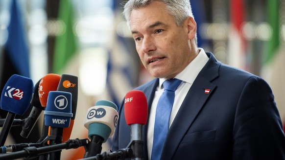 Austria&#039;s Chancellor Karl Nehammer speaks with the media as he arrives for an EU summit in Brussels, Thursday, April 18, 2024. European Union leaders vowed on Wednesday to ramp up sanctions again ...