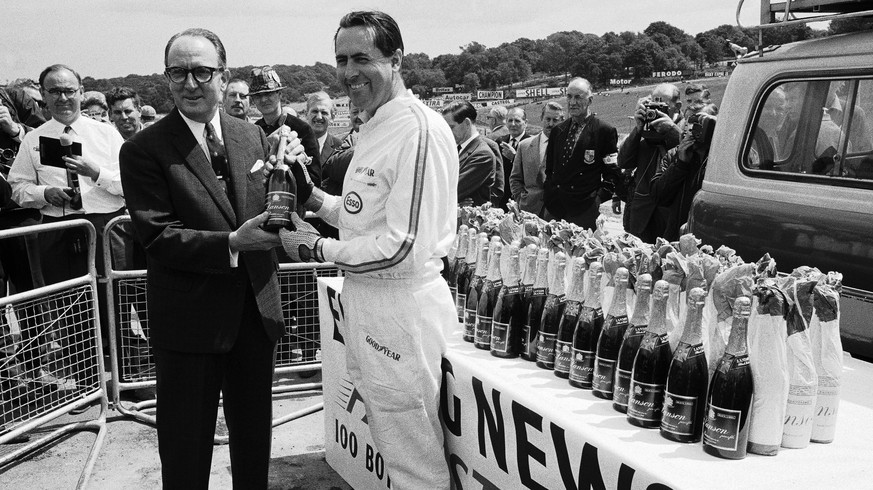 1966 British GP SILVERSTONE, UNITED KINGDOM - JULY 15: Jack Brabham wins 100 bottles of champagne for setting fastest lap during qualifying during the British GP at Silverstone on July 15, 1966 in Sil ...