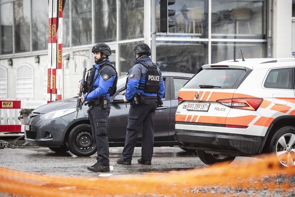 The Police is standing on a closed road in Sion, Switzerland, Monday, December 11, 2023. According to the police of the canton of Valais. An individual fired several shots in Sion on Monday morning, a ...