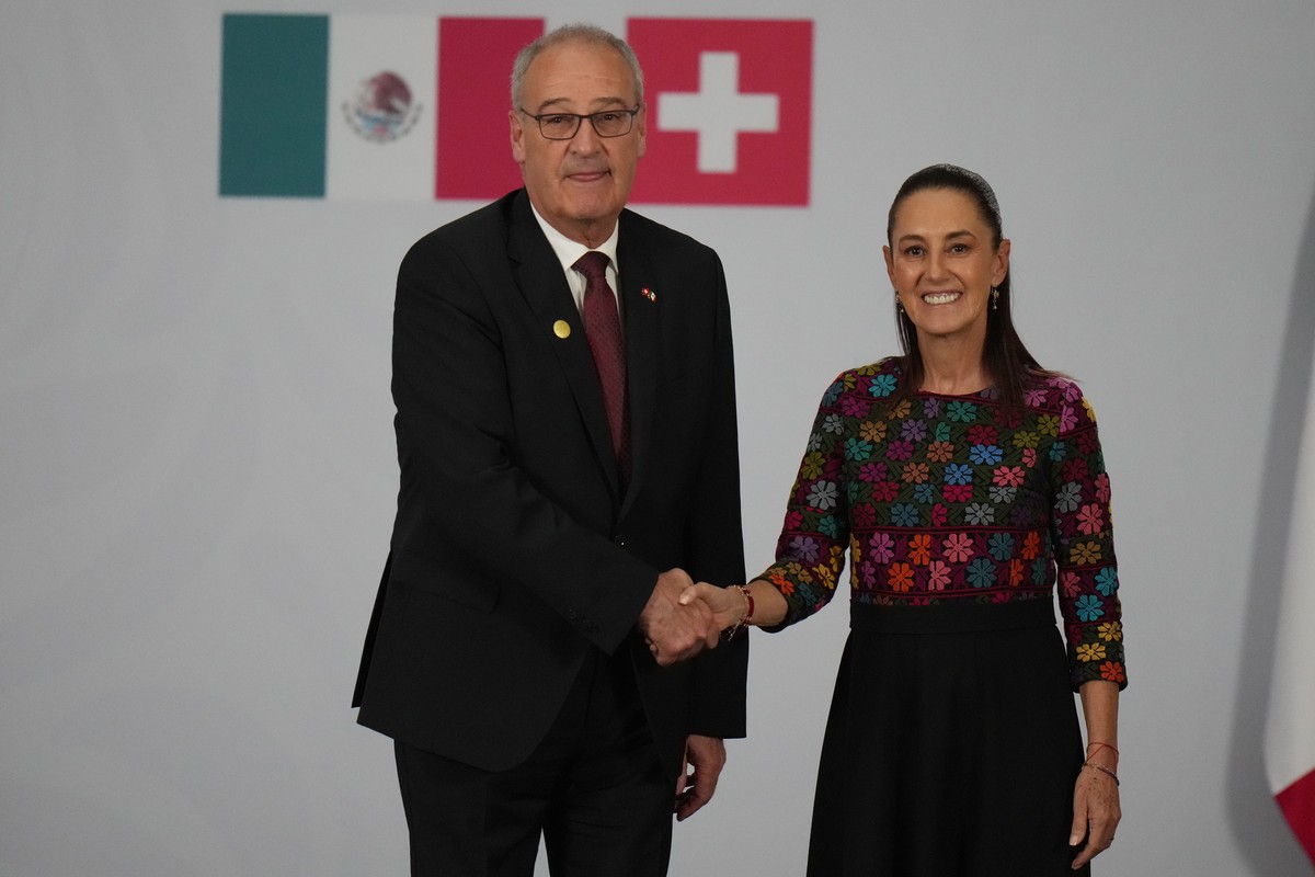 Mexican President Claudia Sheinbaum, right, and Switzerland's President Guy Parmelin shake hands after giving a news conference at the National Palace in Mexico City, Wednesday, July 8, 2026. (AP ...