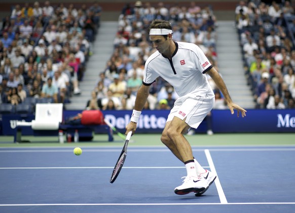 Roger Federer, of Switzerland, returns a shot to Damir Dzumhur, of Bosnia, during the second round of the US Open tennis championships Wednesday, Aug. 28, 2019, in New York. (AP Photo/Eduardo Munoz Al ...