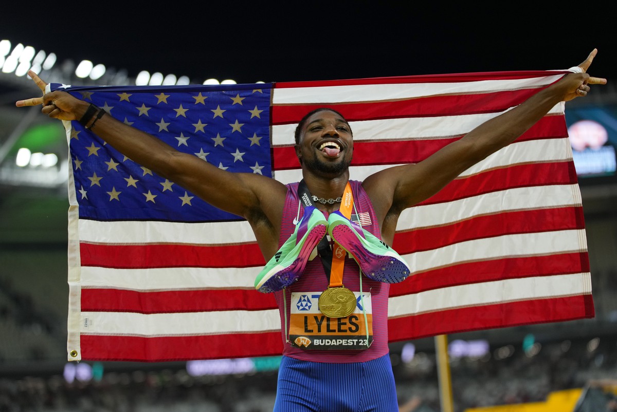 Noah Lyles, of the United States celebrates winning the gold medal in the Men's 200-meters final during the World Athletics Championships in Budapest, Hungary, Friday, Aug. 25, 2023. (AP Photo/Pe ...