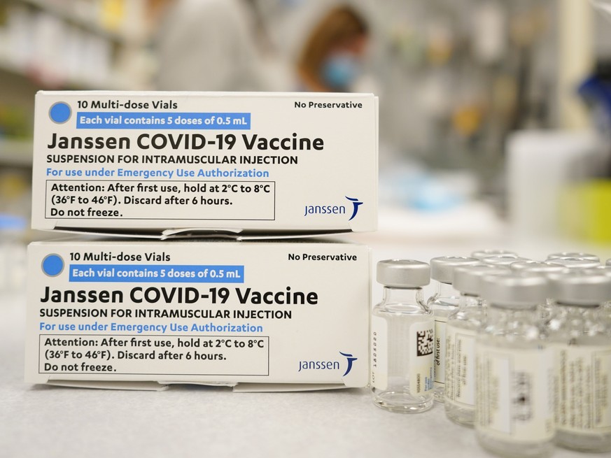 FILE - In this March 6, 2021, file photo, boxes stand next vials of Johnson &amp; Johnson COVID-19 vaccine in the pharmacy of National Jewish Hospital for distribution in east Denver. Denver Mayor Mic ...