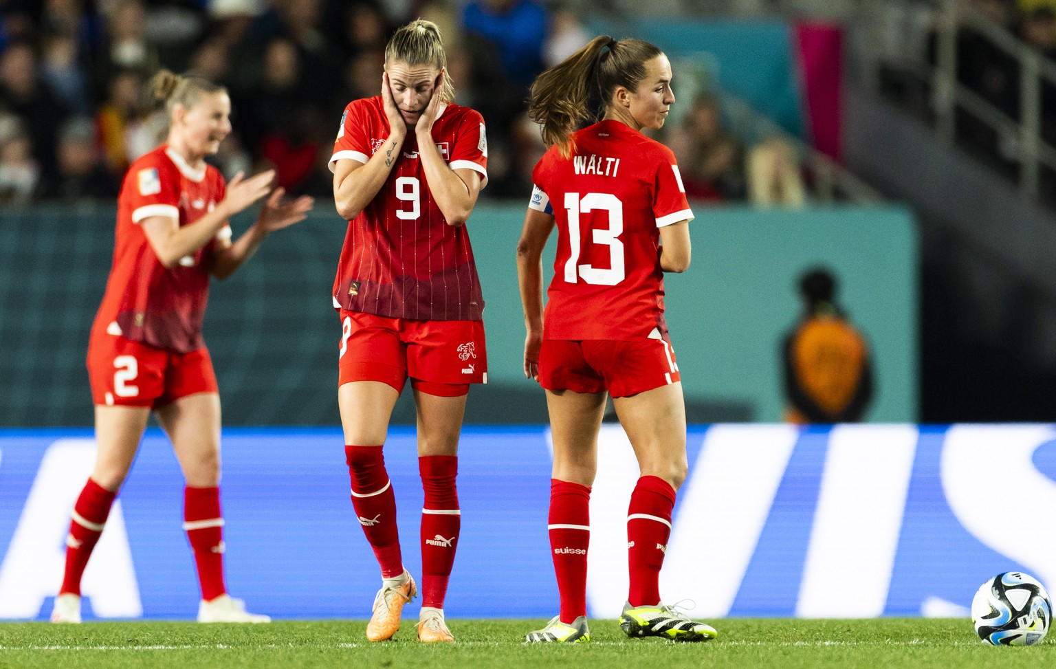 epa10785382 (L-R) Switzerland&#039;s defender Julia Stierli, forward Ana Maria Crnogorcevic and midfielder Lia Waelti react after the 1-5 during the FIFA Women&#039;s World Cup 2023 round of 16 soccer ...