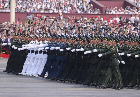 BEIJING, CHINA - OCTOBER 01: Soldiers of the People's Liberation Army march in a parade to celebrate the 70th anniversary of the founding of the People's Republic of China at Tiananmen Square in O...
