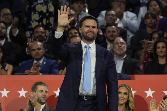 Republican vice presidential candidate JD Vance, R-Ohio, waves during the Republican National Convention Monday, July 15, 2024, in Milwaukee. (AP Photo/Paul Sancya)