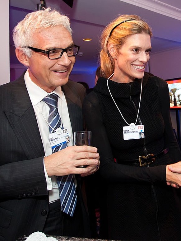 DAVOS, SWITZERLAND - JANUARY 25: Urs Rohner, Credit Suisse Group AG vice chairman, Nadja Schildknecht, Zurich Film Festival co-founder and Hubert Burda attend the Burda DLD Nightcap 2011 at the Steige ...