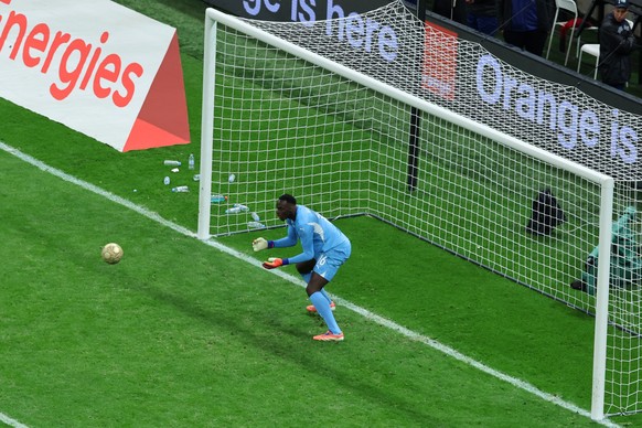 Senegal's goalkeeper Edouard Osoque Mendy saves a panelty from Morocco's Brahim Abdelkader DÌaz during the Africa Cup of Nations final soccer match between Senegal and Morocco in Rabat, Moro ...