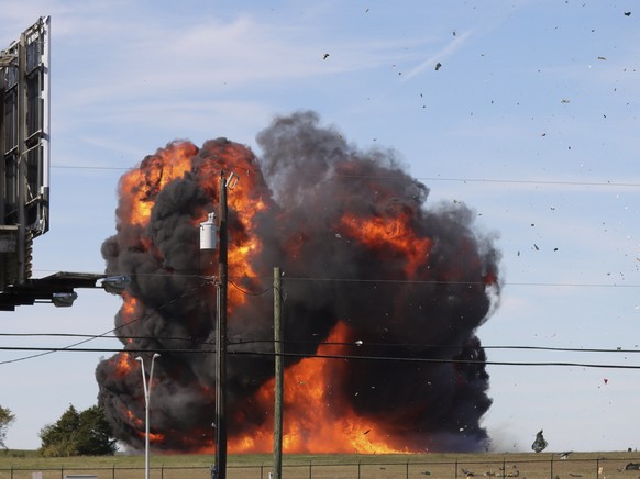 In this photo provided by Nathaniel Ross Photography, a historic military plane crashes after colliding with another plane during an airshow at Dallas Executive Airport in Dallas on Saturday, Nov. 12, ...