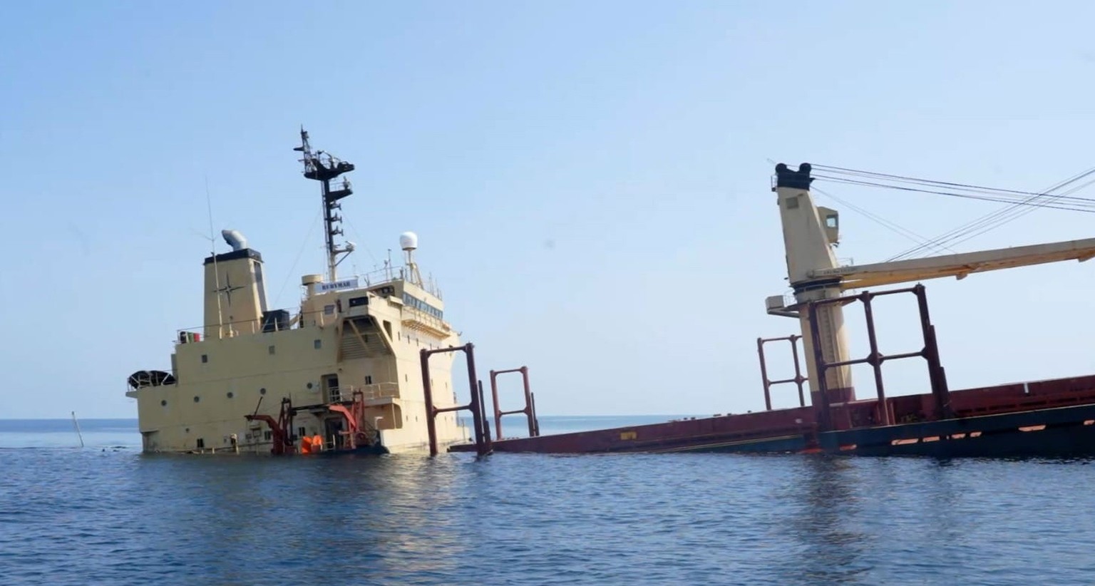 epa11184516 A handout photo made available by Yemeni Al-Joumhouriya TV shows the British-registered cargo vessel, Rubymar, sinking after being damaged in a missile attack by the Houthis in the Red Sea ...