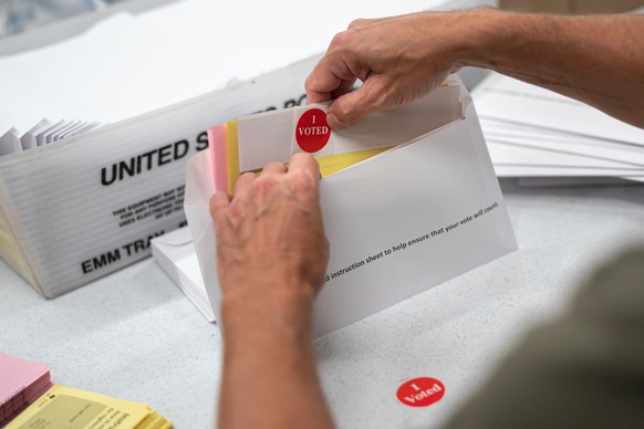 FILE - Todd Gallagher prepares mail in ballot envelopes including an I Voted sticker, July 29, 2020 in Minneapolis. (Glen Stubbe/Star Tribune via AP, File)
Voting Felony Minnesota