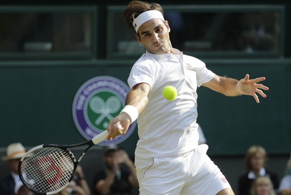 Switzerland&#039;s Roger Federer returns the ball to Germany&#039;s Jan-Lennard Struff during their men&#039;s singles match, on the fifth day of the Wimbledon Tennis Championships in London, Friday J ...