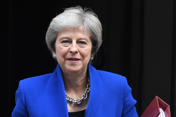 epa07163369 (FILE) - British Prime Minister Theresa May departs No. 10 Downing Street for a Prime Minster&#039;s Questions time at parliament in London, Britain, 24 October 2018 (reissued 13 November  ...