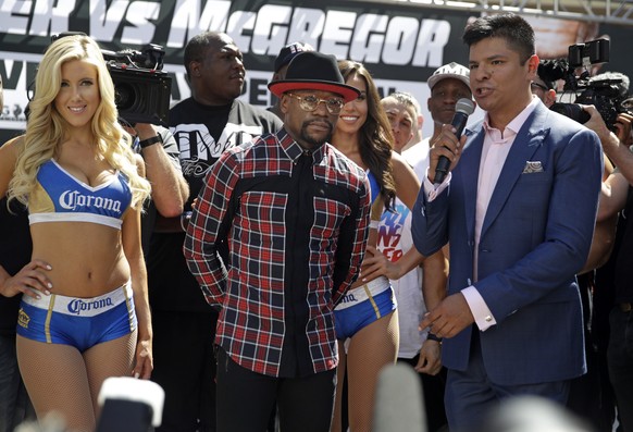 Floyd Mayweather Jr., center, stands on stage during the arrivals for their boxing match Tuesday, Aug. 22, 2017, in Las Vegas. Mayweather is scheduled to fight Conor McGregor in a boxing match Saturda ...