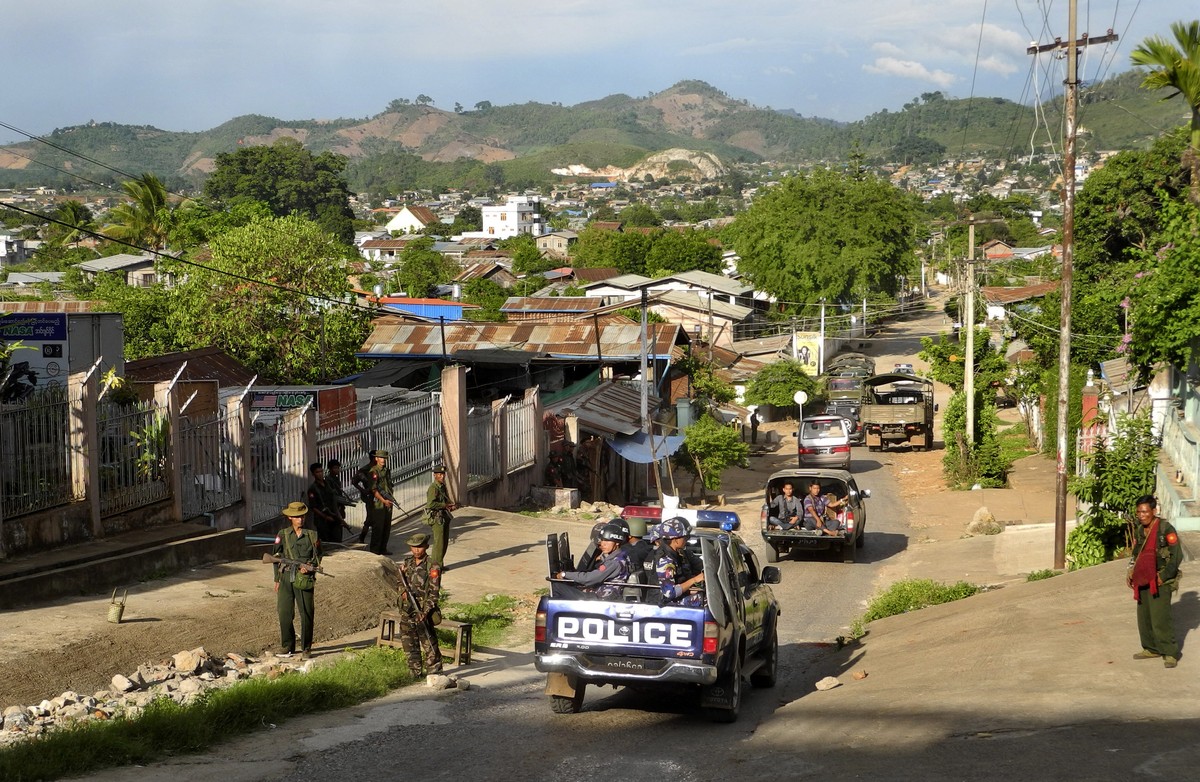 FILE - Army officers stand guard as police officers patrol in Lashio, northern Shan State, Myanmar, on May 29, 2013. Ethnic armed groups claimed on Thursday July 25, 2024 to have captured two strategi ...