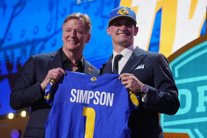 Alabama quarterback Ty Simpson poses with NFL Commissioner Roger Goodell after being chosen by the Los Angeles Rams with the 13th overall pick during the first round of the NFL football draft, Thursda ...