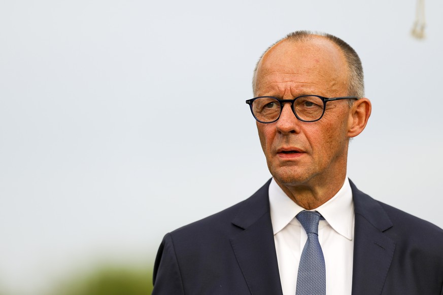 epa13269082 German Chancellor Friedrich Merz attends the inauguration of Helmut-Kohl-Strasse and Rue Francois Mitterrand in Saarlouis, Germany, 28 September 2026. The street names commemorate former G ...