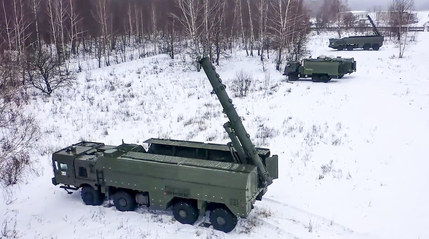 FILE - In this photo taken from video provided by the Russian Defense Ministry Press Service on Tuesday, Jan. 25, 2022, The Russian army's Iskander missile launchers take positions during drills in Ru ...