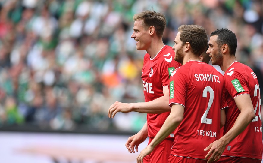 20.05.2023, Bremen: Fu�ball: Bundesliga, Werder Bremen - 1. FC K�ln, 33. Spieltag, wohninvest Weserstadion. K�lns Steffen Tigges (l-r) freut sich mit Benno Schmitz und Ellyes Skhiri �ber sein Tor zum  ...